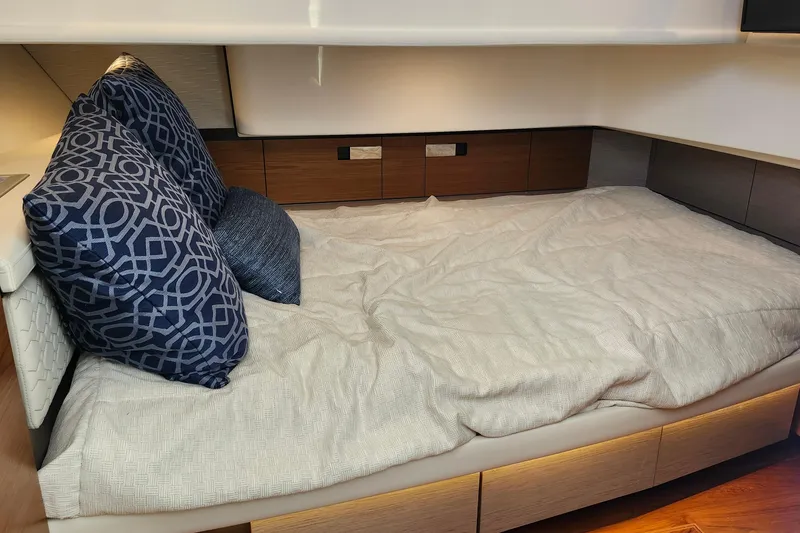 Slide: The Image of Luxurious cabin interior of 2022 Tiara Yachts 38 LS with plush bedding and stylish pillows. - 68