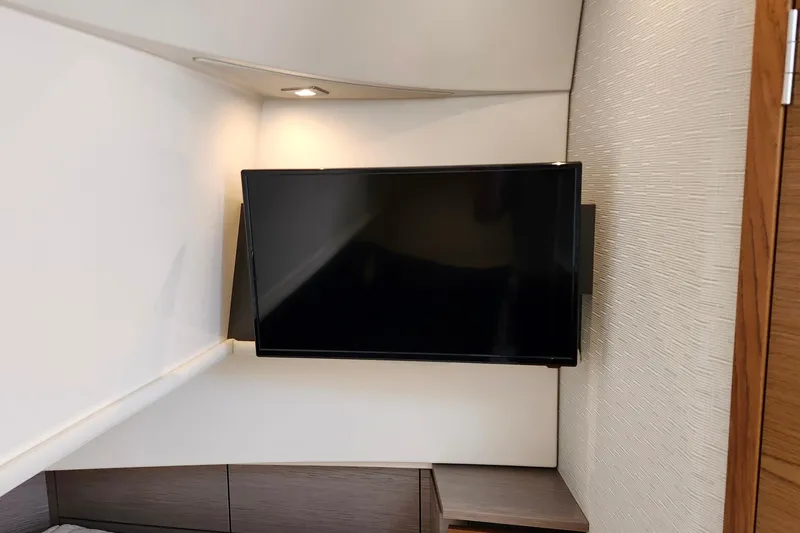 Slide: The Image of Flat-screen TV in 2022 Tiara Yachts 38 LS cabin, modern interior design. - 69