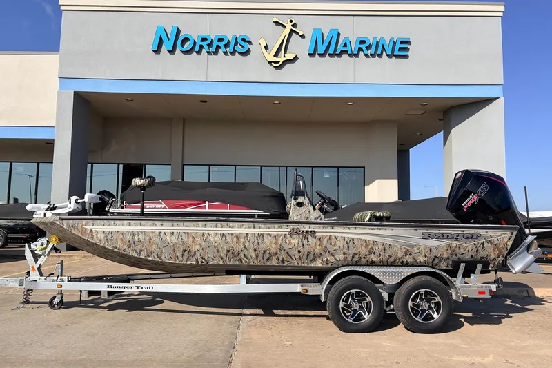 The Image of 2025 Ranger RB210 boat on trailer at Norris Marine dealership. - 1