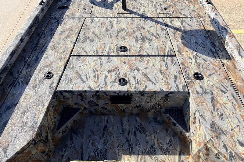 Slide: The Image of 2025 Ranger RB210 boat deck with camouflage pattern and multiple storage compartments. - 16