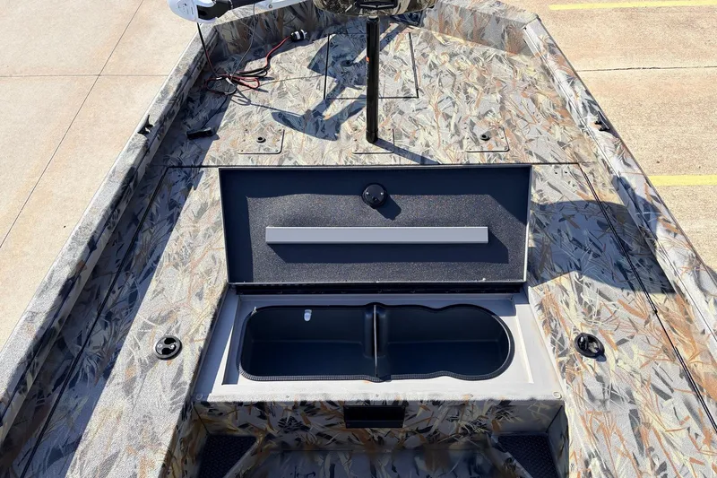 Slide: The Image of 2025 Ranger RB210 boat with open storage compartment, camo design, and modern features. - 22