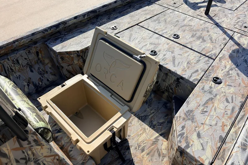 Slide: The Image of 2025 Ranger RB210 boat interior with camo design and open Orca cooler. - 28