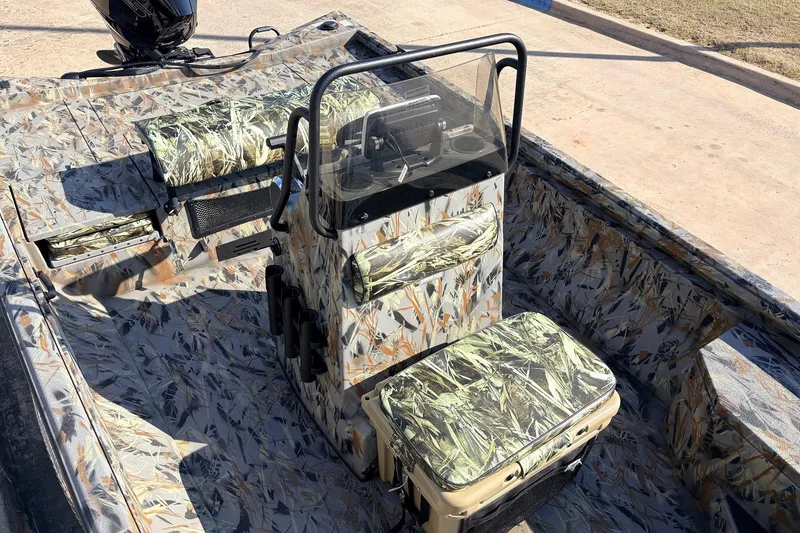 Slide: The Image of 2025 Ranger RB210 boat interior with camouflage seating and console design. - 31