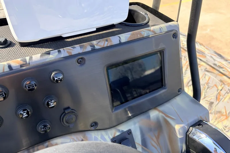 Slide: The Image of Control panel of 2025 Ranger RB210 boat with digital display and buttons. - 37