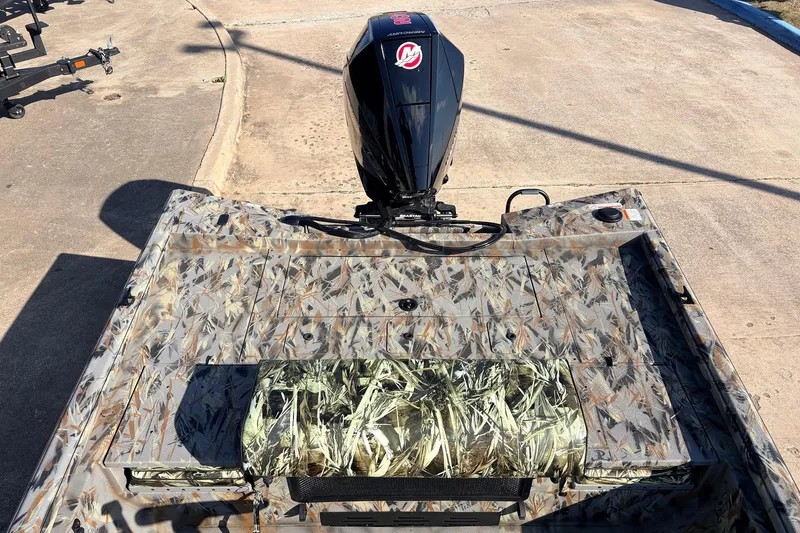 Slide: The Image of 2025 Ranger RB210 boat with camouflage design and powerful outboard motor. - 39