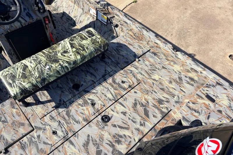 Slide: The Image of 2025 Ranger RB210 boat interior with camouflage seating and flooring design. - 40
