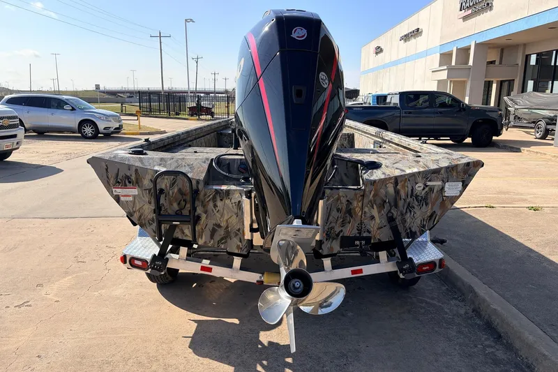 Slide: The Image of 2025 Ranger RB210 boat with camouflage design and powerful outboard motor. - 6