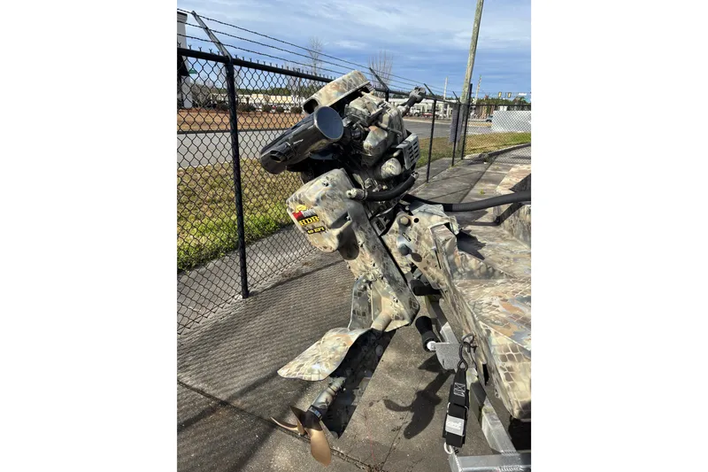 Slide: The Image of 2023 Excel 1754 Shallow Water F4 boat with camouflage design and powerful motor. - 17