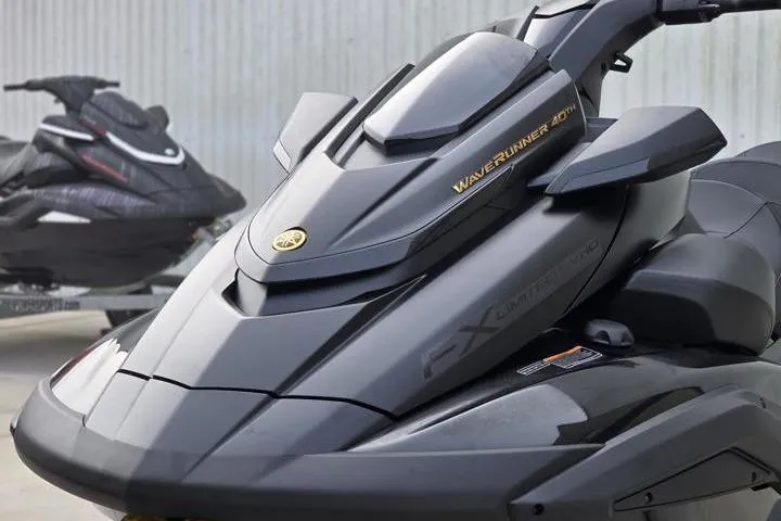 Slide: The Image of 2026 Yamaha WaveRunner FX Limited SVHO, sleek black design, close-up view. - 2