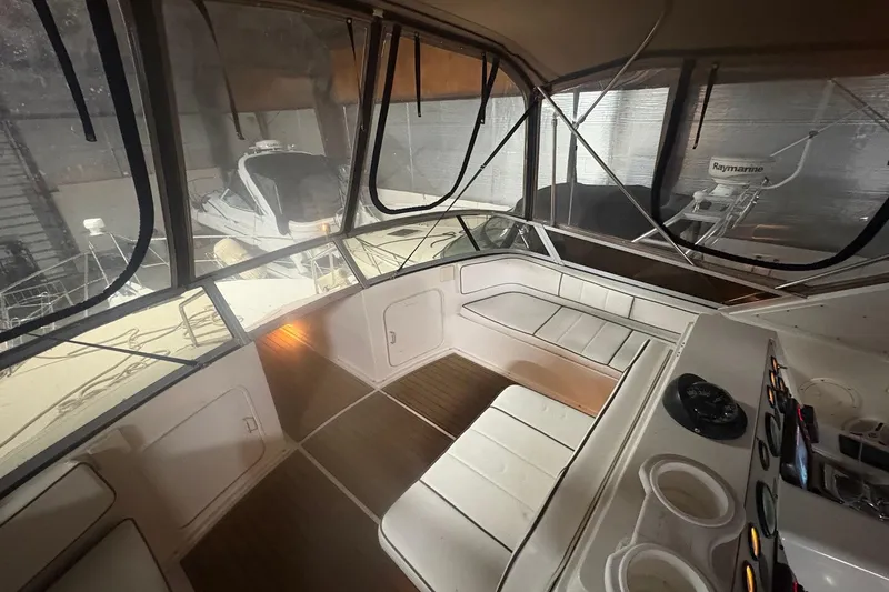Slide: The Image of Interior view of 1996 Carver 38 Santego yacht cockpit with steering wheel and control panel. - 1