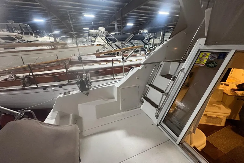 Slide: The Image of 1996 Carver 38 Santego yacht cockpit with navigation controls and seating area. - 10
