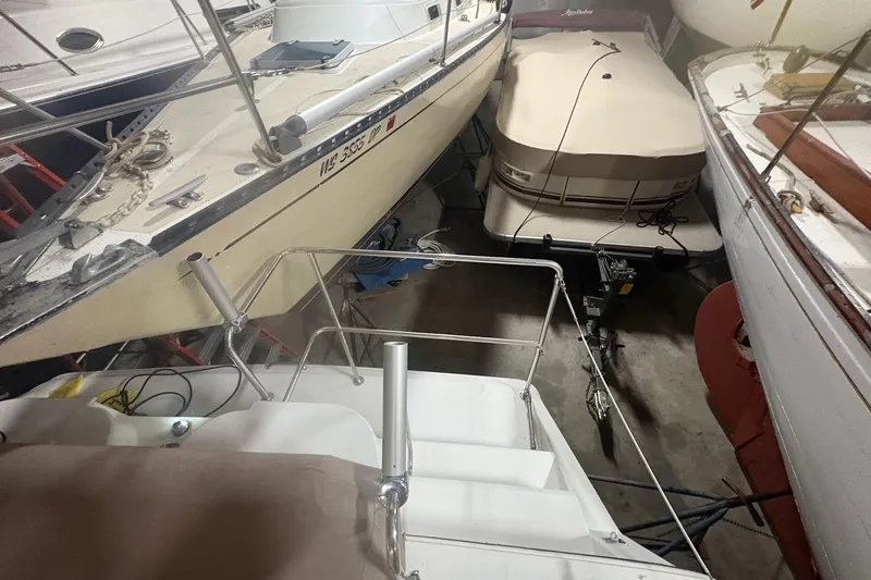 Slide: The Image of 1996 Carver 38 Santego yacht in storage, surrounded by other boats. - 12