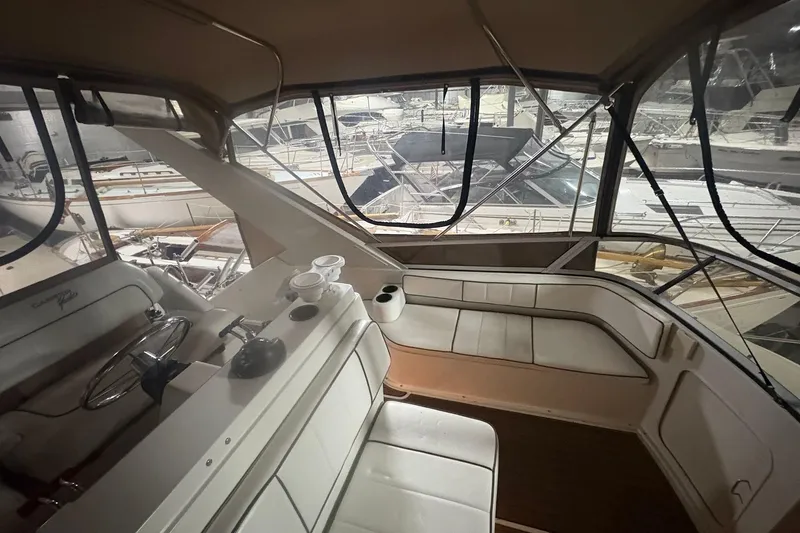 Slide: The Image of 1996 Carver 38 Santego yacht interior with modern kitchen and seating area. - 2