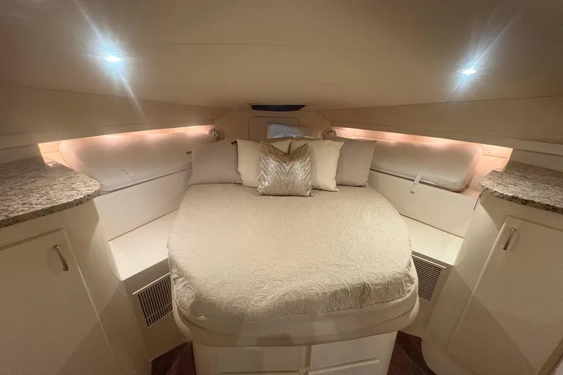 Slide: The Image of Interior of 1996 Carver 38 Santego yacht with white seating and TV. - 21
