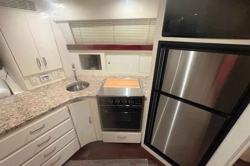 Slide: The Image of Luxurious cabin interior of 1996 Carver 38 Santego yacht with cozy bed and ambient lighting. - 23