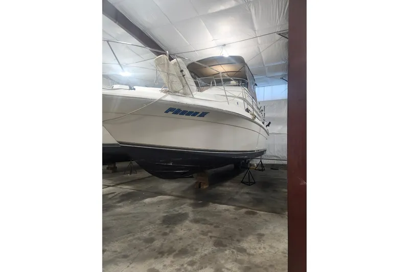 Slide: The Image of 1996 Carver 38 Santego yacht stored indoors on stands. - 31