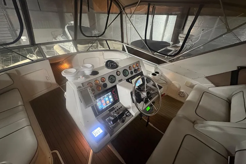 Slide: The Image of Interior view of a 1996 Carver 38 Santego yacht in a storage facility. - 4