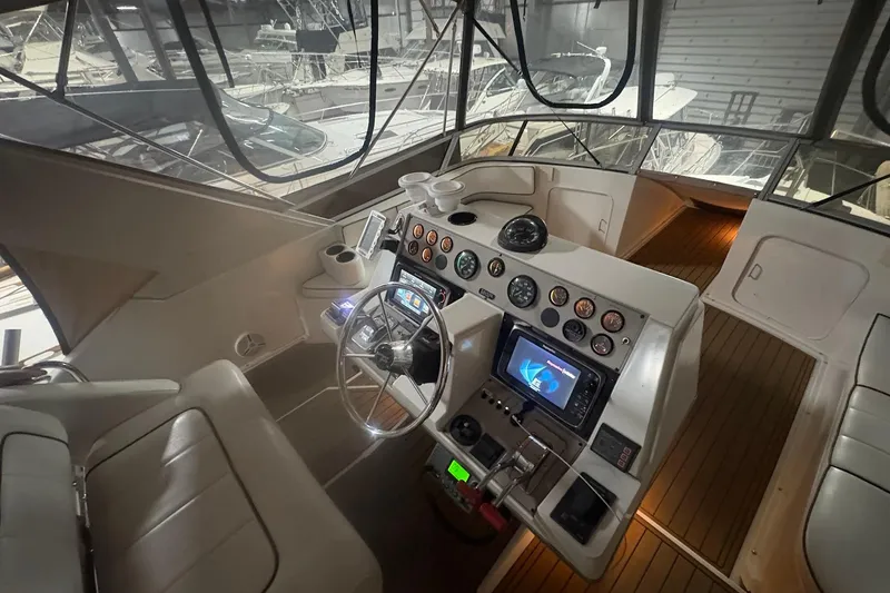 Slide: The Image of 1996 Carver 38 Santego yacht interior with seating and navigation equipment. - 5