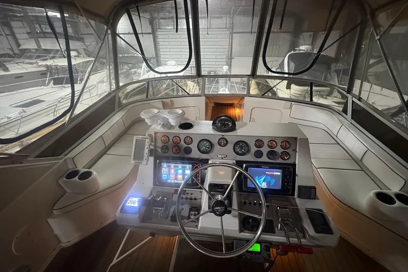 Slide: The Image of Interior view of 1996 Carver 38 Santego yacht with seating and helm. - 6