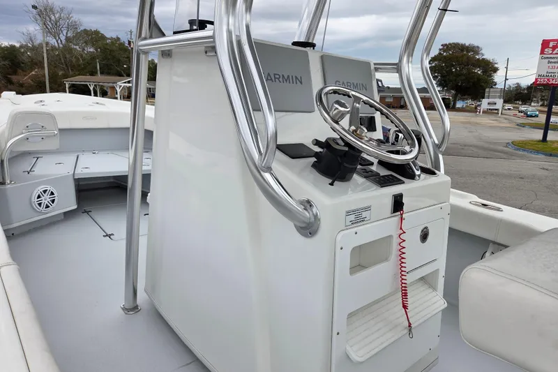 Slide: The Image of 2024 Pair Customs 27 Center Console boat with Garmin navigation system. - 10
