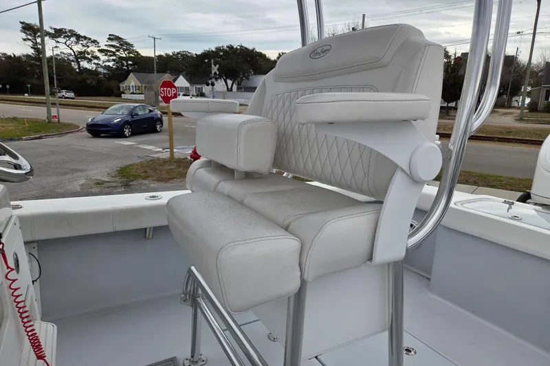 Slide: The Image of 2024 Pair Customs 27 Center Console boat with luxurious white seating and armrests. - 12