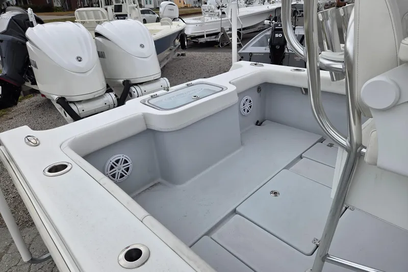 Slide: The Image of 2024 Pair Customs 27 Center Console boat interior with dual Yamaha engines. - 13