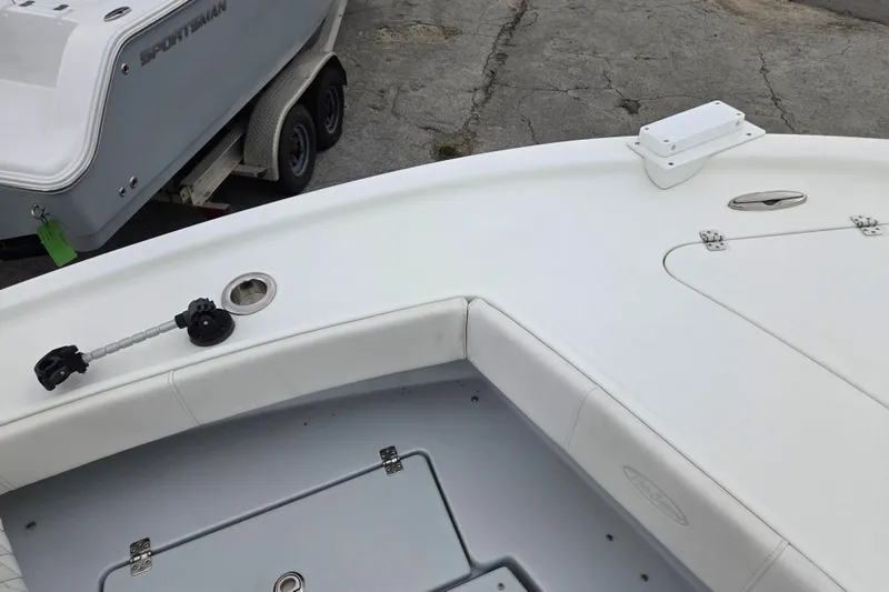 Slide: The Image of 2024 Pair Customs 27 Center Console boat interior with seating and storage compartments. - 16