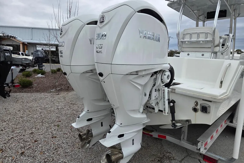 Slide: The Image of 2024 Pair Customs 27 Center Console with twin Yamaha V6 outboard engines. - 3