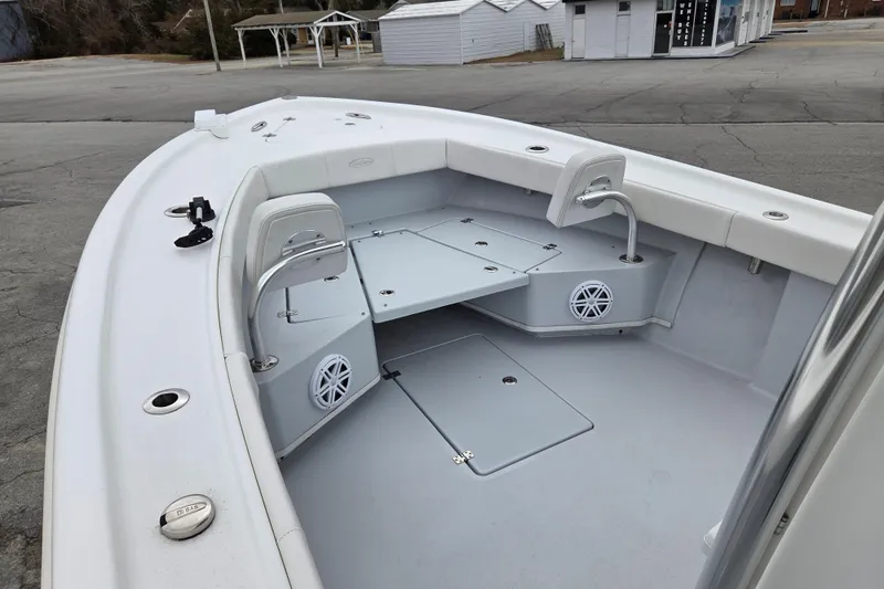 Slide: The Image of 2024 Pair Customs 27 Center Console boat interior with seating and speakers. - 8