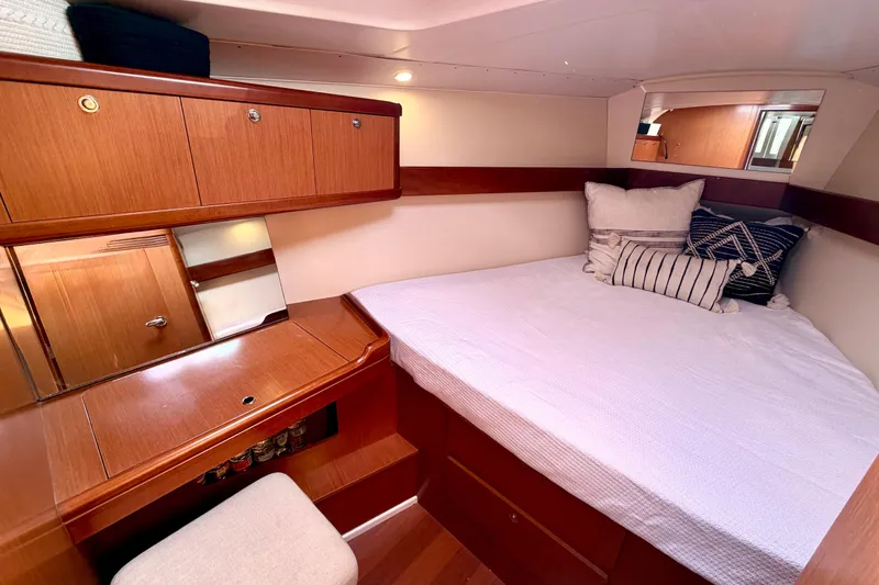 Slide: The Image of Cozy cabin interior of 2008 Beneteau Oceanis 37 yacht with wooden furnishings. - 14