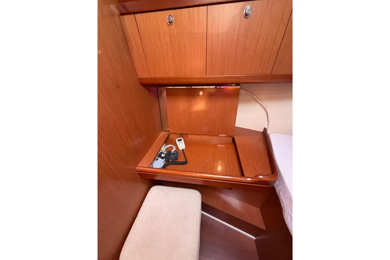 Slide: The Image of Wooden interior of 2008 Beneteau Oceanis 37 yacht with desk and storage cabinets. - 17