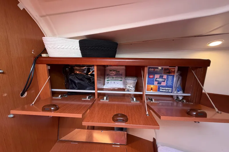 Slide: The Image of Cabinet storage on 2008 Beneteau Oceanis 37 yacht with emergency medical kit. - 18