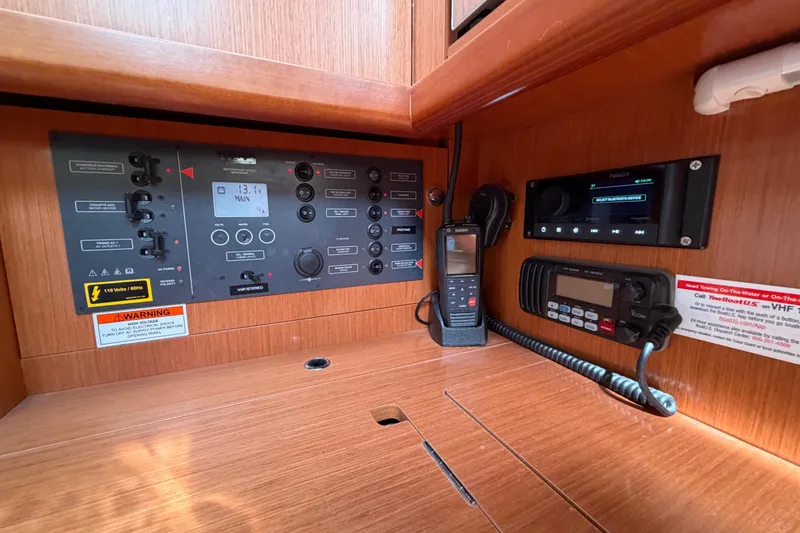 Slide: The Image of Control panel of a 2008 Beneteau Oceanis 37 sailboat with navigation and communication equipment. - 22