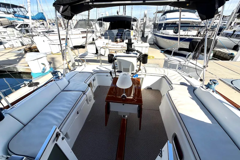 Slide: The Image of 2008 Beneteau Oceanis 37 sailboat cockpit with seating, docked at marina. - 33