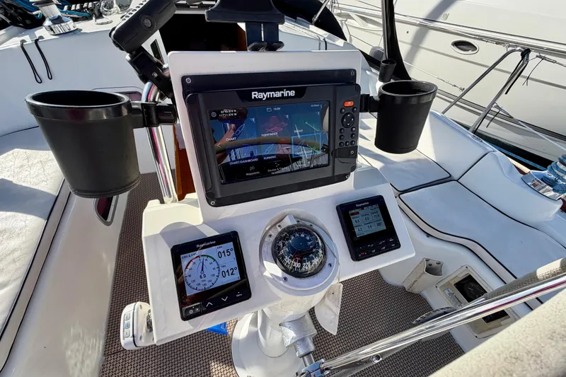 Slide: The Image of Cockpit of 2008 Beneteau Oceanis 37 with navigation instruments and compass. - 38