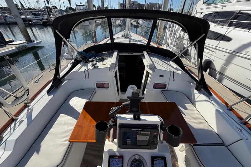 Slide: The Image of 2008 Beneteau Oceanis 37 sailboat cockpit with navigation equipment and seating at marina. - 40