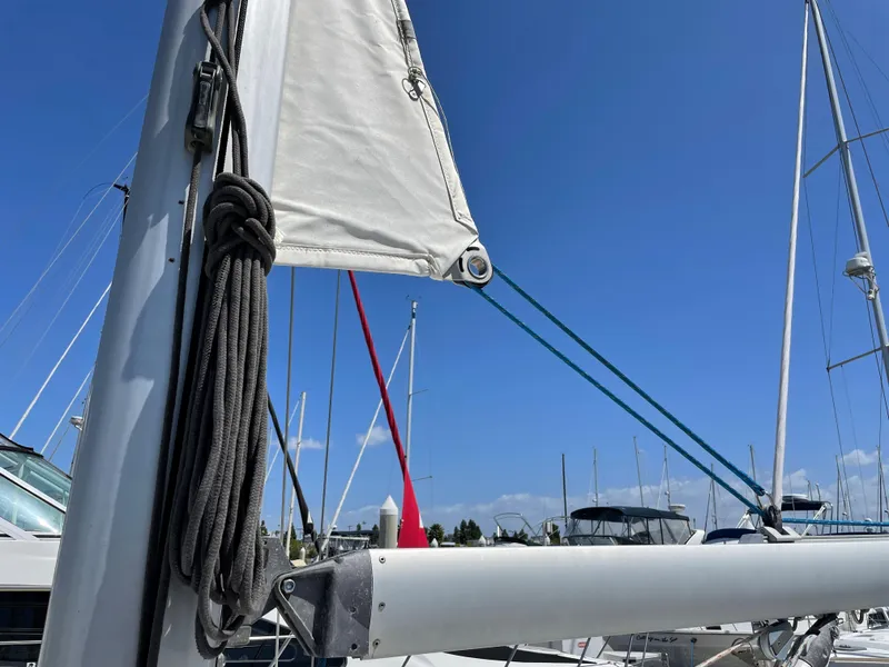 Slide: The Image of Beneteau Oceanis 37 sailboat, 2008 model, docked under clear blue sky. - 46