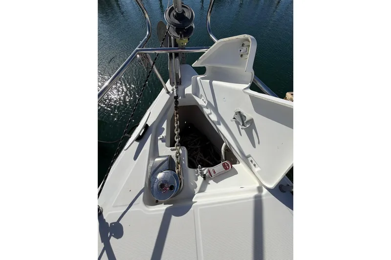 Slide: The Image of Bow of 2008 Beneteau Oceanis 37 sailboat with anchor chain and winch. - 53