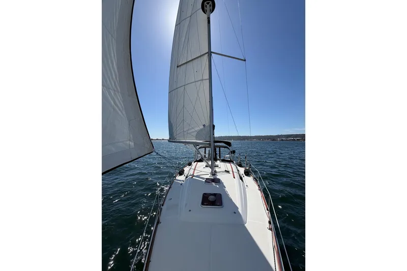 Slide: The Image of Sailing on a 2008 Beneteau Oceanis 37 yacht under clear blue skies. - 54