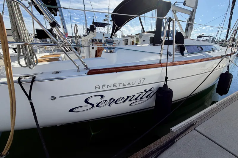 Slide: The Image of 2008 Beneteau Oceanis 37 sailboat named Serenity docked at marina. - 57