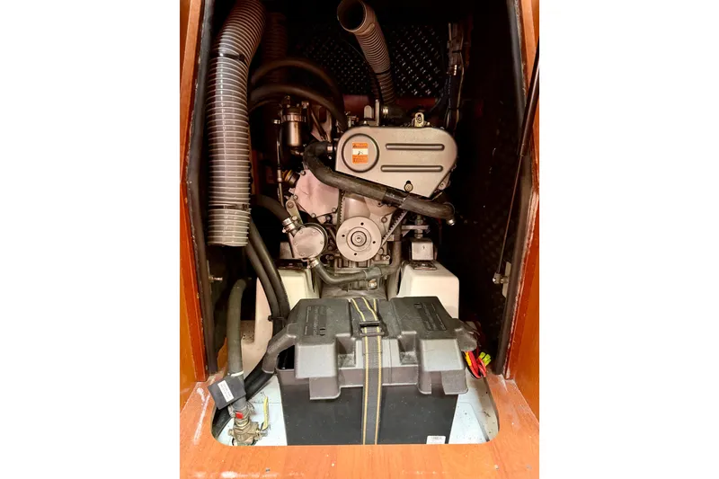 Slide: The Image of Engine compartment of a 2008 Beneteau Oceanis 37 sailboat, showcasing mechanical components. - 60