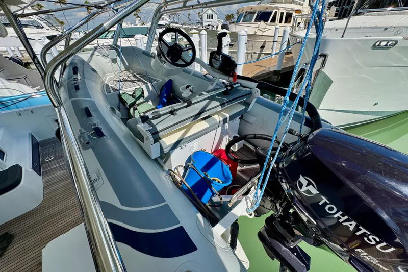 Slide: The Image of 2017 Lagoon 42 boat with Tohatsu motor, docked at marina. - 10