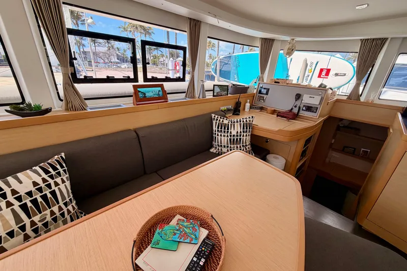Slide: The Image of Interior of 2017 Lagoon 42 catamaran with modern seating and navigation area. - 13
