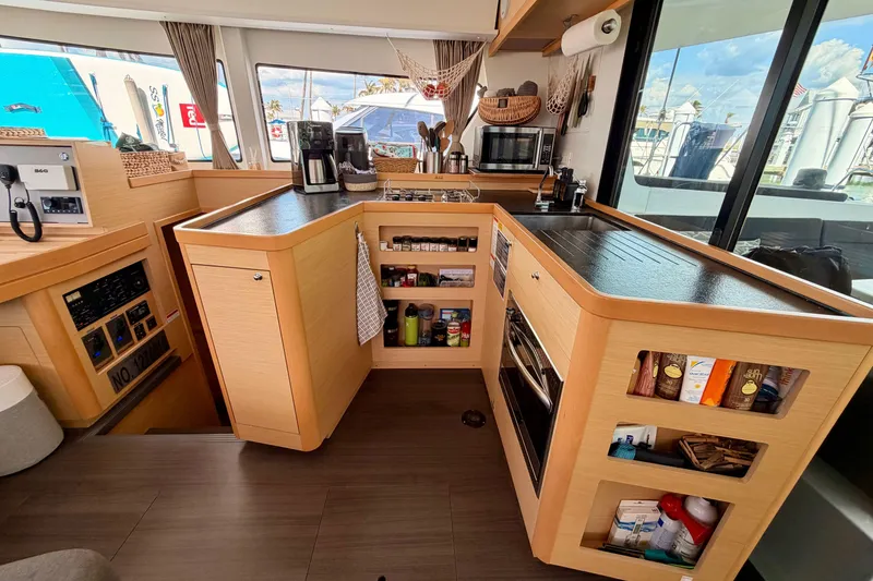 Slide: The Image of Modern kitchen interior of 2017 Lagoon 42 catamaran with appliances and storage. - 15