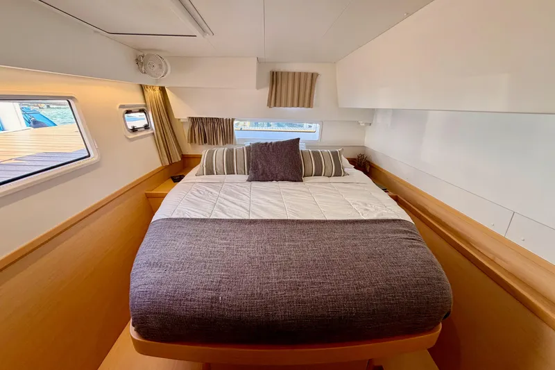 Slide: The Image of Cozy bedroom interior of 2017 Lagoon 42 catamaran with modern design and natural light. - 18