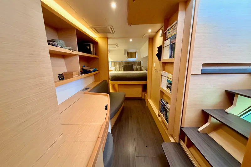 Slide: The Image of Interior of 2017 Lagoon 42 catamaran with modern wood finish and cozy cabin. - 19
