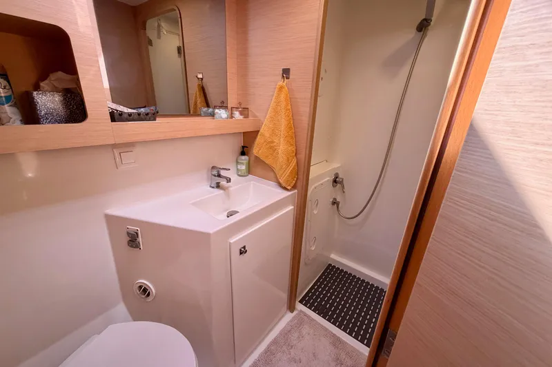 Slide: The Image of Modern bathroom in 2017 Lagoon 42 yacht with shower, sink, and mirror. - 27