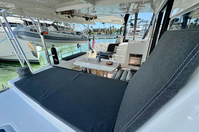 Slide: The Image of Luxurious 2017 Lagoon 42 catamaran with spacious deck and comfortable seating area. - 7