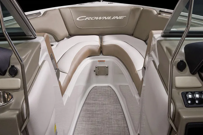 Slide: The Image of Manufacturer Provided Image: 2026 Crownline 220 SS boat interior with beige and white seating, featuring a spacious bow area. - 3