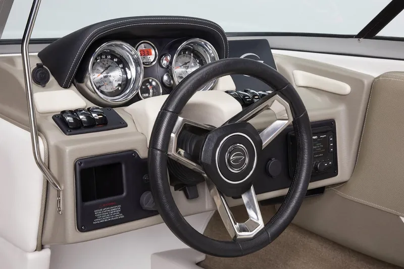 Slide: The Image of Manufacturer Provided Image: 2026 Crownline 220 SS boat dashboard with modern steering wheel and instrument panel. - 5